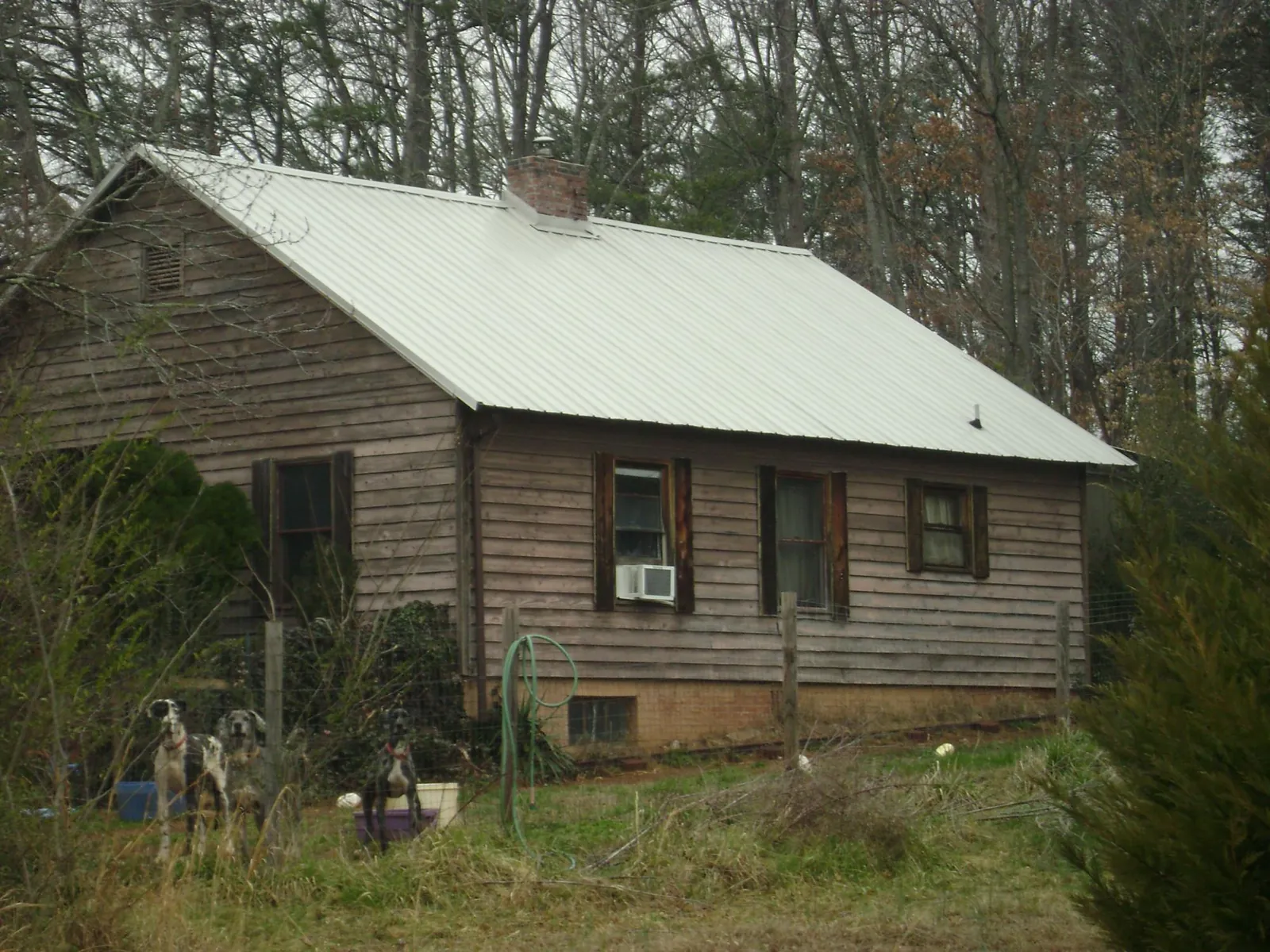 White metal roof on an old wood sided farmhouse in Tuxedo Park